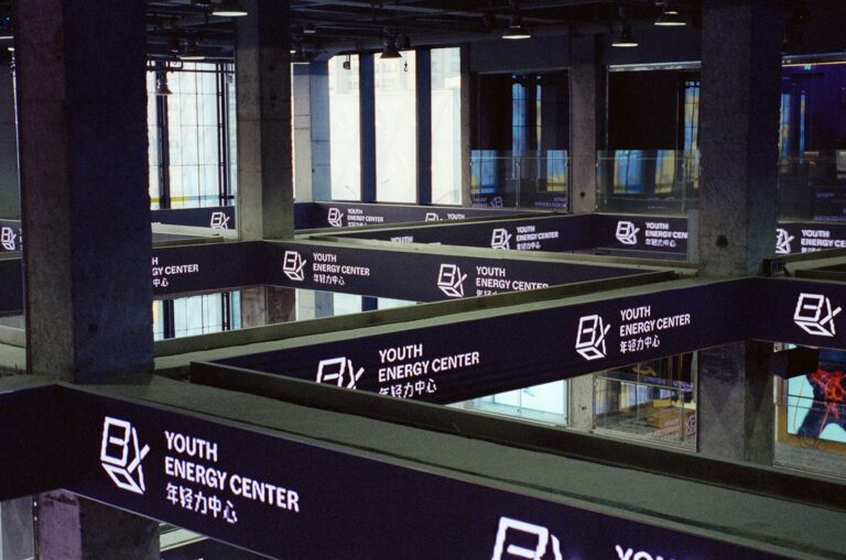 Modern interior with signs for youth energy center.